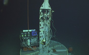 A watertight seafloor well is used to take samples from aquifers deep beneath the ocean.